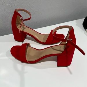 “A New Day” red block heels.